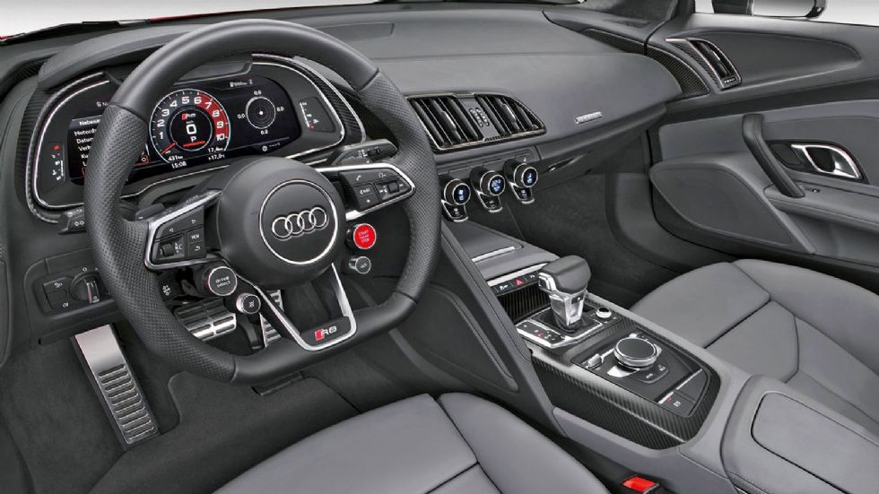 Κορυφαία ποιότητα κατασκευής στο εσωτερικό του R8. Στο τιμόνι βρίσκονται στα κουμπιά του drive select και του performance mode. 
